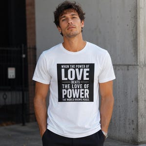 Power of Love T-Shirt, Empire State Climb Inspired Tee, World Peace Quote Shirt, Love Over Power Graphic T-Shirt