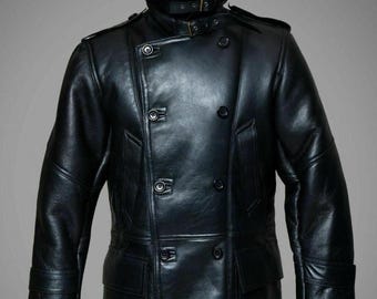 May include: A black leather coat with a double-breasted design. The coat features a faux fur collar, multiple buttons, and pockets. The coat has a military-inspired style.