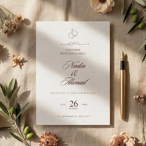 May include: A wedding invitation with the names Nadia & Ahmad, featuring elegant calligraphy and the date 26th March. The invitation is on textured paper, with a gold pen and floral accents.