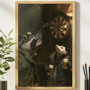 May include: A framed wall art print depicting a raccoon in a green jacket throwing a dart at a board while an opossum in a blue coat holds two glasses of beer. The scene is set in a dimly lit room with dark wood paneling and a chalkboard background.