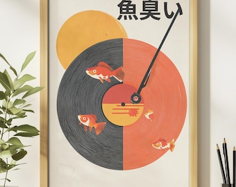 May include: Framed art print featuring a stylized design of a vinyl record split into black and orange halves, with goldfish swimming around it. A yellow sun and Japanese text are in the background. The print is in a light brown wooden frame.