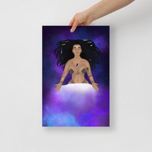 May include: A print depicting a woman with long black hair and tattoos, set against a cosmic backdrop of purple and blue. The woman is shown floating on a cloud, with arms outstretched, creating a celestial and spiritual theme.