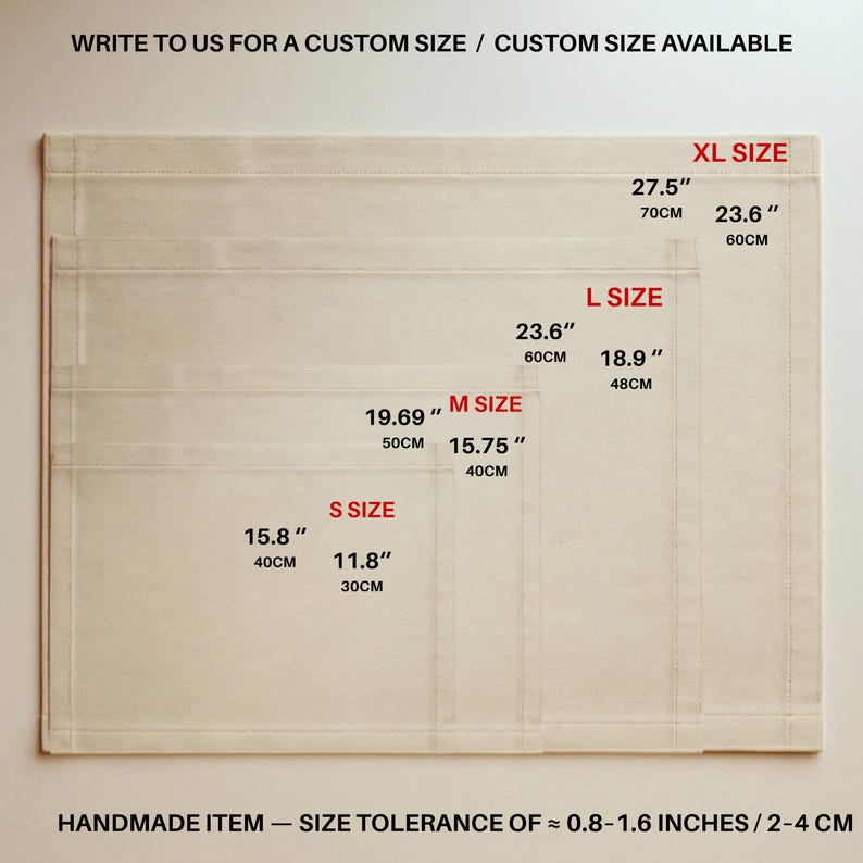 May include: Four stacked rectangular off-white fabric mats in sizes S, M, L, and XL. Text indicates sizes from 15.8 by 11.8 inches to 27.5 by 23.6 inches. Text reads: WRITE TO US FOR A CUSTOM SIZE / CUSTOM SIZE AVAILABLE and HANDMADE ITEM &mdash; SIZE TOLERANCE OF &asymp; 0.8-1.6 INCHES.