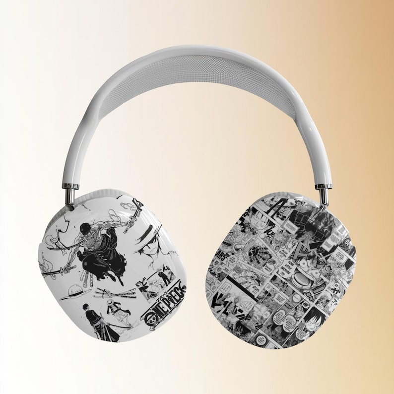May include: White wireless headphones with a black and white manga print featuring characters from the anime One Piece. The print includes the text "One Piece" on one earcup.