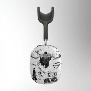 May include: White wireless headphones with a black headband and a black and white graphic design featuring characters from the anime series One Piece. The graphic includes the text "ONE PIECE".