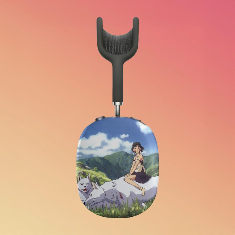 May include: A pair of black headphones with a white and blue design featuring a girl riding a white wolf in a green field with mountains and a blue sky in the background.