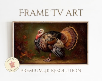 May include: A framed print of a turkey in a vintage style. The turkey has brown, black, and orange feathers, a red wattle, and a white head. The background is a dark, autumnal scene with fallen leaves. Text at the top reads "FRAME TV ART".
