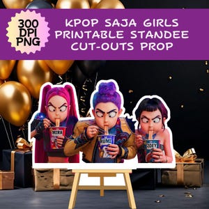 May include: Printable standee cut-outs of three KPOP SAJA girls eating noodles. The standees have pink, blue, and black hair, and are holding cups of noodles. The image includes text that says "300 DPI PNG" and "KPOP SAJA GIRLS PRINTABLE STANDEE CUT-OUTS PROP."
