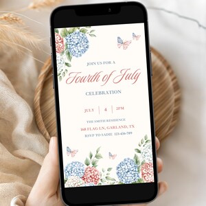 May include: A smartphone displays a Fourth of July invitation. The invitation features floral arrangements of blue and pink hydrangeas, with butterfly accents. The text reads "Join us for a Fourth of July Celebration" with date, time, and RSVP information.