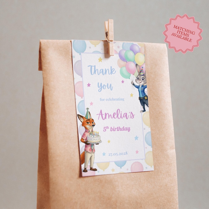 May include: A brown paper gift bag with a tag that says "Thank you for celebrating Amelia's 5th birthday." The tag features cartoon characters and balloons. A wooden clip holds the tag to the bag. A pink sticker says "Matching items available."