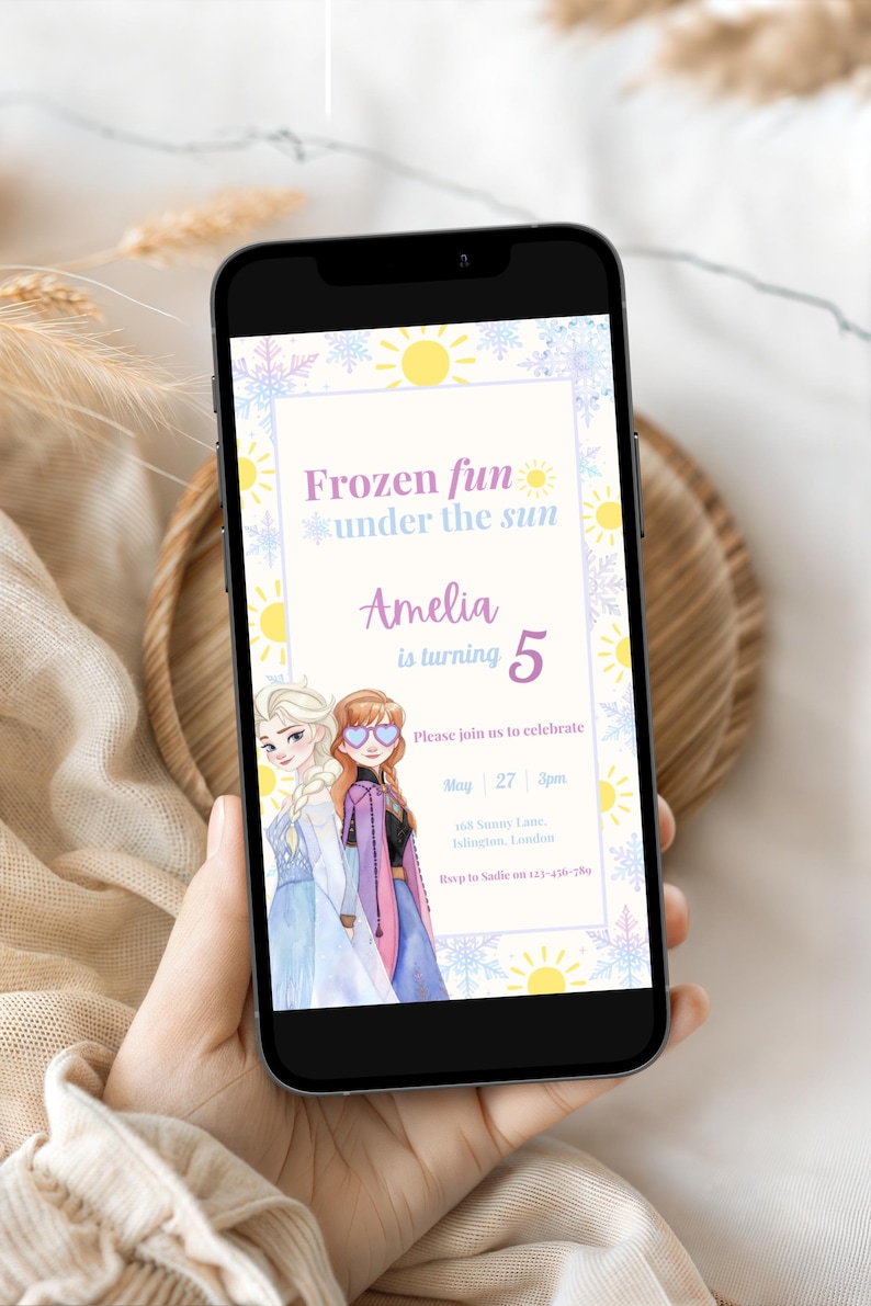 May include: A digital birthday invitation displayed on a smartphone screen featuring illustrations of two characters, Elsa and Anna, with the text Frozen fun under the sun, Amelia is turning 5, Please join us to celebrate, May 27, 3pm, 168 Sunny Lane, Islington, London, Rsvp to Sadie on 123-456-789.