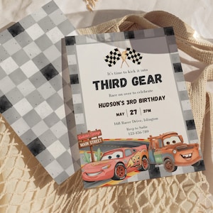 May include: A rectangular birthday invitation card featuring a checkered border, two checkered flags, and a lightning bolt icon. The text reads: It's time to kick it into THIRD GEAR, Race on over to celebrate HUDSON'S 3RD BIRTHDAY, MAY 27 2PM, 168 Racer Drive, Islington, Rsvp to Sadie 123-456-789. A red race car and an orange tow truck are illustrated at the bottom.