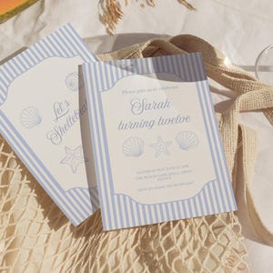 May include: Two light blue and white striped invitations with seashell and starfish illustrations. One invitation reads "Let's Shellebra" and the other says "Sarah turning twelve". The invitations are on a beige net bag.