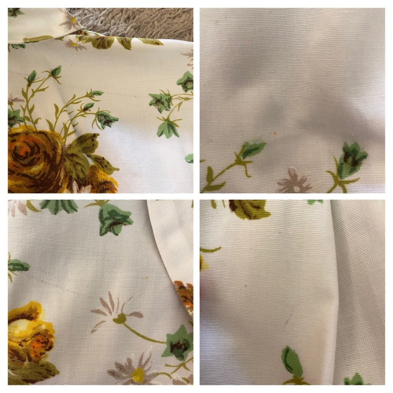 May include: Close-up of a white fabric with a floral pattern. The fabric features yellow, brown, and green flowers. The fabric has a subtle texture.