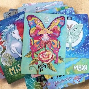 Butterfly fairies on the fool card. Luna moth on the moon card.