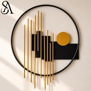 May include: A circular black metal wall art piece featuring vertical gold rods of varying lengths arranged in front of black rectangular panels. A solid gold circle is positioned on the right side, creating a contrast against the black elements.