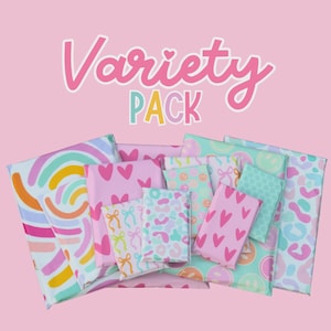 May include: A collection of rectangular packages wrapped in colorful paper featuring patterns of hearts, bows, leopard spots, and rainbows. The text Variety PACK is displayed in large, bold, pink and multicolored letters above the items.