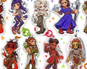 May include: Set of eight colorful cartoon character keychains. Each keychain features a different character with unique features and accessories. The characters are depicted in a chibi style, with large heads and small bodies. The keychains are made of clear acrylic and have a shiny finish.
