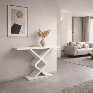 May include: A white console table featuring a flat rectangular top and a geometric base composed of two interlocking, rounded square shapes that connect to a solid rectangular floor plate, providing a stable and balanced structure.