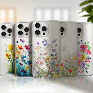 Peut inclure: Cinq coques de téléphone blanches avec des motifs floraux. Les coques présentent des illustrations à l'aquarelle colorées de fleurs, dont des jonquilles, des fleurs sauvages et des papillons. Les coques sont disposées en rangée, présentant la variété des motifs.