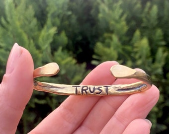 TRUST CUFF // hand printed trust brass bracelet // Hidden message word jewelry // Hand carved engraved gold metal word cuff // engraved cuff