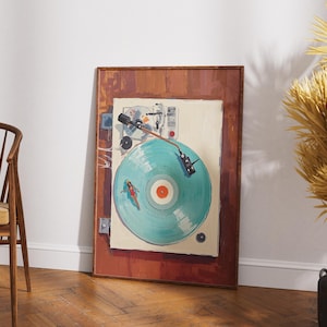 May include: A framed artwork depicts a vintage turntable with a teal record. The artwork has a brown wooden frame and is leaning against a white wall. A wooden chair with a yellow cushion is in the foreground.