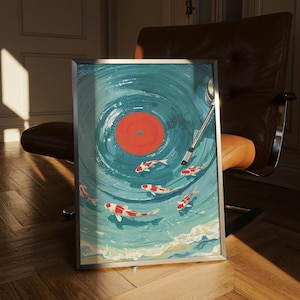 Puede incluir: Impresión artística enmarcada que representa un diseño de vinilo azul con peces koi rojos y blancos nadando en agua turquesa. La obra de arte tiene un marco plateado y un brazo de tocadiscos.