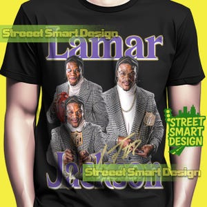 May include: Black t-shirt featuring a graphic of Lamar Jackson in a checkered blazer and turtleneck. The design includes the name "Lamar" in purple and the name "Jackson" in purple, with the text "Street Smart Design".