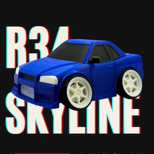 May include: A blue toy car with white wheels and black windows. The car is a Nissan Skyline GTR, with the text "R34 SKYLINE" in white with red and blue accents. The text "BIGHOUSE3D" is in a red rectangle at the bottom.