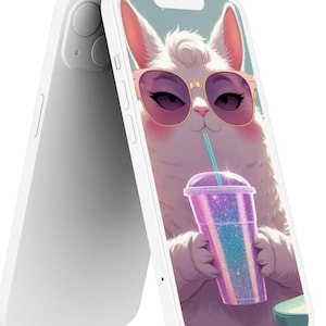 May include: White phone case featuring a cartoon cat wearing sunglasses and drinking from a purple glittery cup with a blue straw. The cat has pink cheeks and is set against a light blue background. The phone case is white.