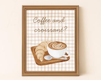 Könnte beinhalten: Gerahmter Aquarelldruck mit einem Croissant, einer Kaffeetasse mit Latte Art und einem Löffel auf einem Holztablett. Der Hintergrund ist ein beige-weißes Vichy-Muster. Der Text "Coffee and croissant?" steht oben.