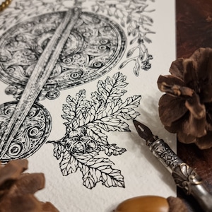 May include: A black and white ink drawing of a sword and shield with a leafy branch and acorns. The drawing is on a white background and is surrounded by brown pine cones and a quill pen.