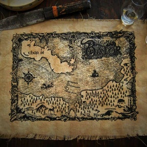 May include: A vintage-style map of the "Realm of Balor" printed on a brown canvas with a frayed edge. The map features a compass, a large body of water labeled "char pf", and several smaller bodies of water. The map also includes several trees, a bear, and the text "Realm of Balor".