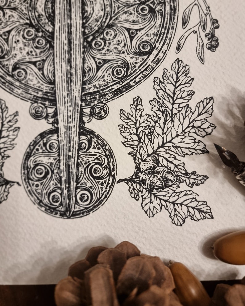May include: A black and white illustration of a Celtic knot design with a sword in the center. The design is surrounded by leaves and acorns.