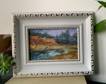 Pintura a óleo original de paisagem com moldura ornamentada.