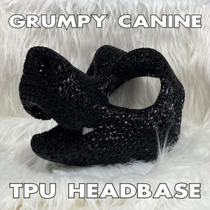 May include: Black TPU headbase for a furry costume, shaped like a dog's head with a textured surface. The headbase is on a white fluffy surface. "GRUMPY CANINE" and "TPU HEADBASE" are written in white text on the image.