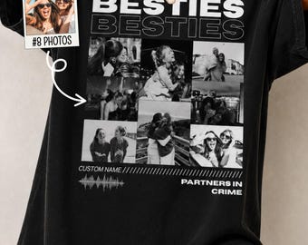 May include: A black t-shirt featuring the text BESTIES in bold white letters, followed by a collage of eight black and white photographs. Below the photos, the text reads CUSTOM NAME and PARTNERS IN CRIME, accompanied by a graphic sound wave illustration.