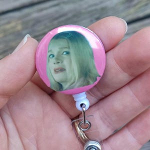 side eye button comes with either a belt clip or alligator clip.