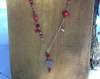 RED - an asymmetrical necklace that's fun and fanciful.