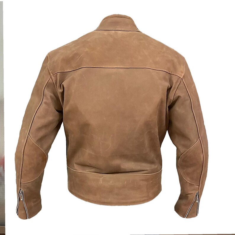 May include: A brown leather jacket with a zipper closure and elbow patches. The jacket has a stand-up collar and a slightly cropped length.