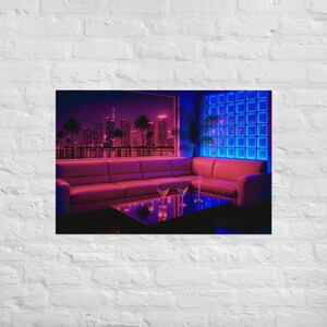 May include: A framed print depicting a retro-style interior scene. The image features a pink sofa, a dark square table with two martini glasses, and a window view of a city skyline at night. The scene is illuminated with neon lighting.