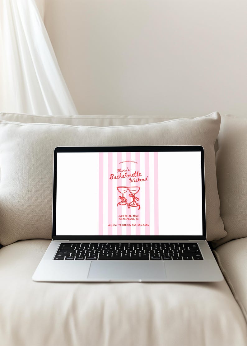 May include: Laptop displaying a pink and white striped invitation for "Olivia's Bachelorette Weekend." The invitation features two red cocktail glasses with bows, event details, and a phone number. The laptop is on a white pillow.