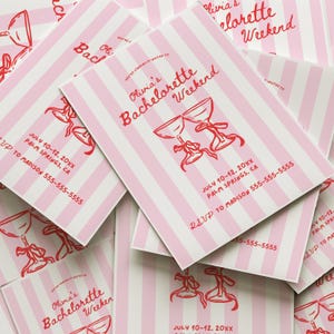 May include: Pink and white striped bachelorette party invitations. The invitations feature red text that reads "Olivia's Bachelorette Weekend" and include the date, location, and RSVP information. The design includes illustrations of two champagne glasses.