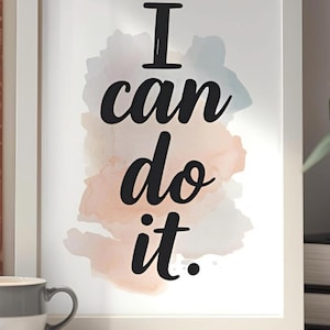 Puede incluir: Impresión artística enmarcada con la frase motivacional "I can do it" en escritura negra. El fondo presenta un diseño de acuarela en tonos suaves de rosa, azul y melocotón. La impresión está en un marco blanco.