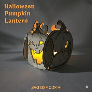 May include: A Halloween pumpkin lantern made of wood, with a smiling jack-o'-lantern face carved into the front. The lantern is lit from within, casting a warm glow. The text "Halloween Pumpkin Lantern" is at the top.