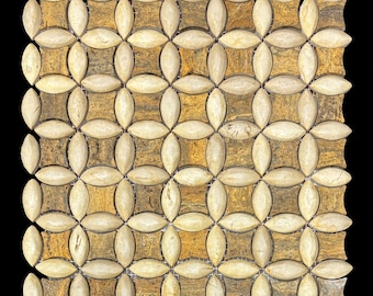 May include: A square mosaic tile pattern featuring a repeating floral design. The tiles are a mix of beige and brown, creating a natural stone appearance. The pattern is made up of oval-shaped tiles arranged in a flower-like design.