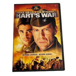 May include: DVD case for the movie "Hart's War" featuring Bruce Willis and Colin Farrell. The cover has a war-themed design with the actors' faces and the tagline "Beyond Courage, Beyond Honor."