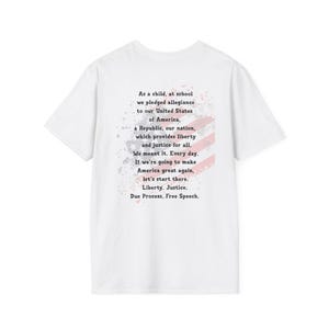 May include: White t-shirt with the text "As a child, at school we pledged allegiance to our United States of America..." and a faded red and white flag design. The shirt is made of a soft material.