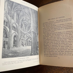 May include: An open book displays a detailed black and white illustration of Glastonbury Abbey's interior. The opposite page features text titled "The Child of Nature." The image is a historical architectural drawing.
