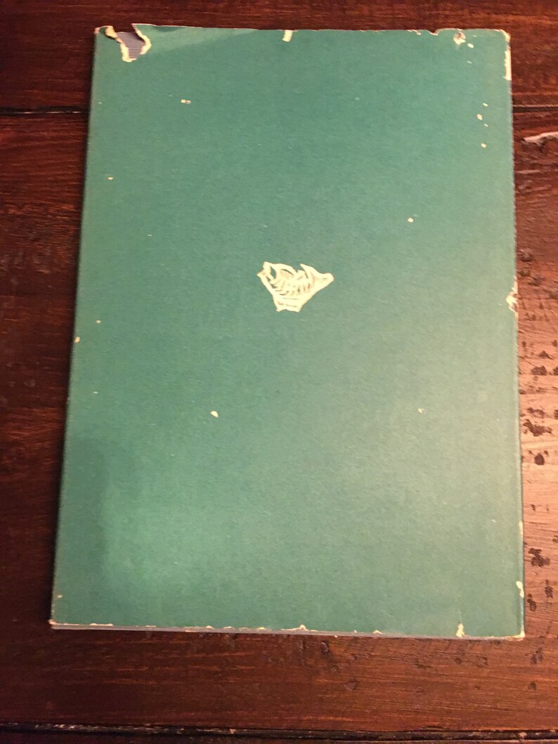 May include: A green book with a white logo on the front cover.